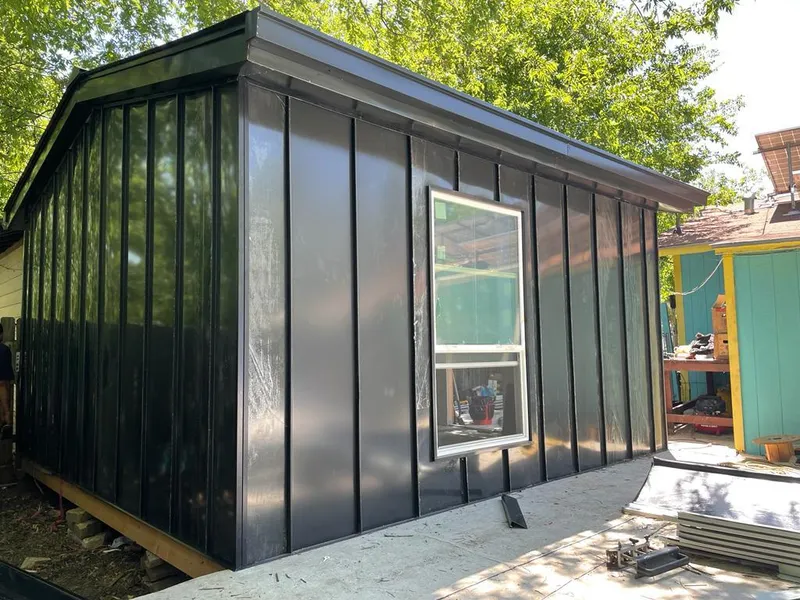 Black standing seam metal wall panels for Roof Inspection in Pound Ridge